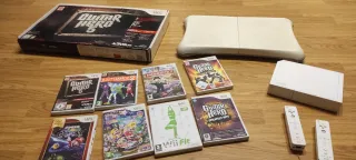 Consola Nintendo Wii+2 mandos+guitarra+tabla+8jueg