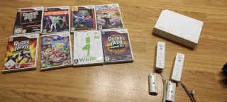 Consola Nintendo Wii+2 mandos+guitarra+tabla+8jueg