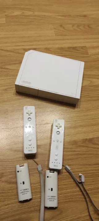 Consola Nintendo Wii+2 mandos+guitarra+tabla+8jueg