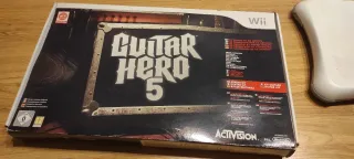 Consola Nintendo Wii+2 mandos+guitarra+tabla+8jueg