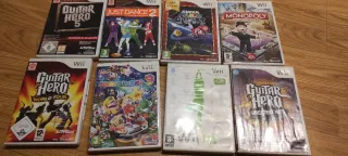 Consola Nintendo Wii+2 mandos+guitarra+tabla+8jueg