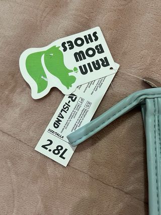 Neceser bolso de aseo viaje azul con etiqueta