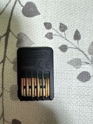 Lote Nintendo Switch, joigons y dos juegos