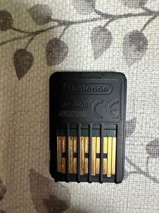 Lote Nintendo Switch, joigons y dos juegos