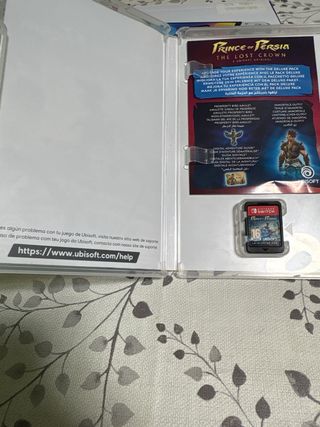 Lote Nintendo Switch, joigons y dos juegos