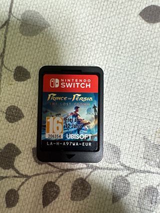 Lote Nintendo Switch, joigons y dos juegos