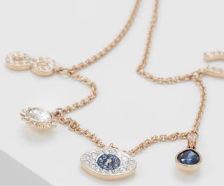 Pulsera Swarovski Infinito Ojo Azul Dorado