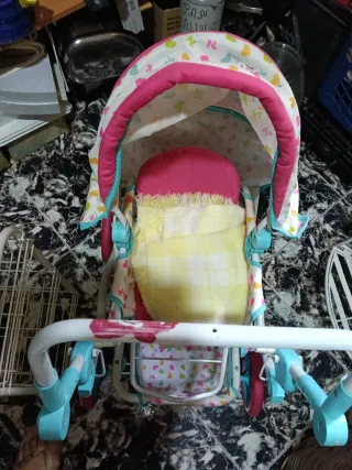 Cochecito de juguete para muñecas