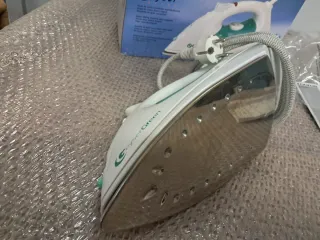 Plancha Taurus Geyser y Secador Braun