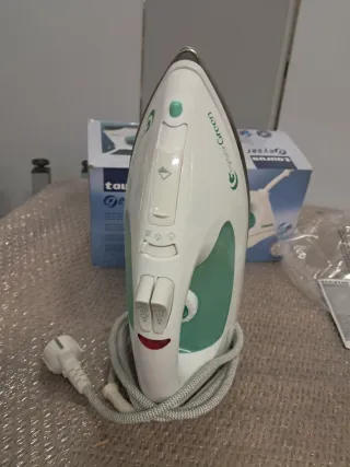 Plancha Taurus Geyser y Secador Braun