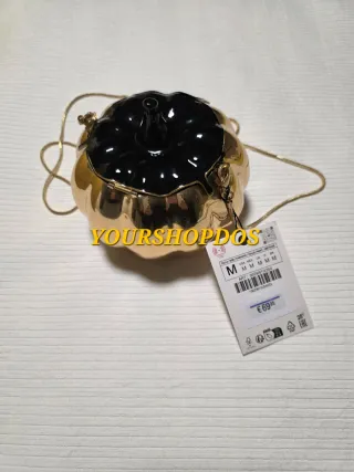 Clutch efecto metalizado Zara