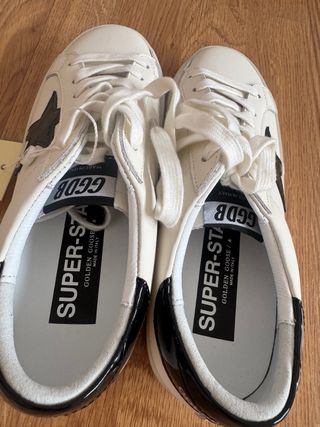 Zapatillas Golden Goose Hi Star Negras y Blancas