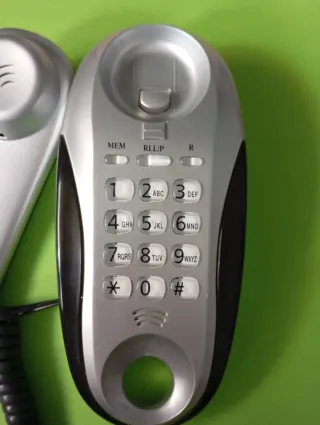 Teléfono fijo Telecom plateado y negro