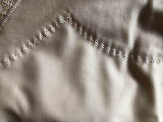 Body de lencería color marfil.