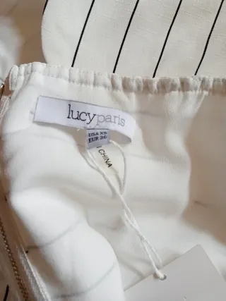 Top Lucy Paris blanco y negro con etiqueta