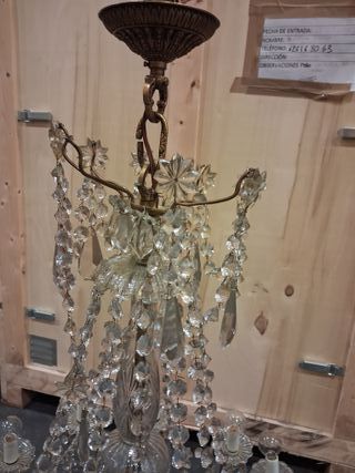 Lámpara de lágrimas dorada y transparente