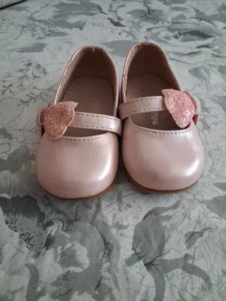 Zapatillas niña lazo brillante rosa