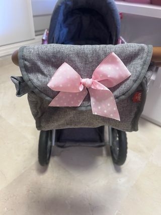Carro de muñeca gris con lazo
