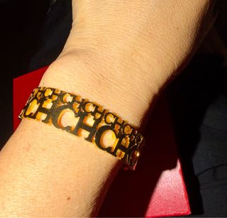 Pulsera Carolina Herrera Dorada
