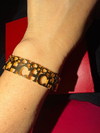 Pulsera Carolina Herrera Dorada