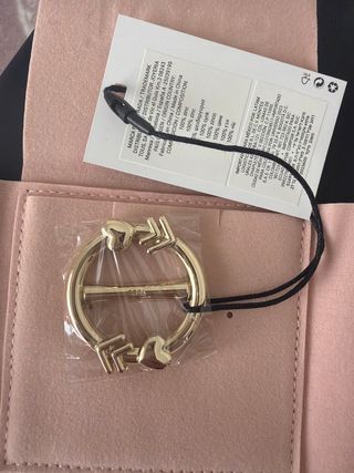 Pasador pañuelo Tous dorado