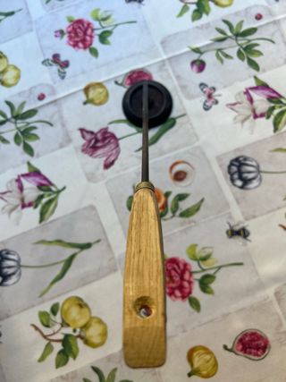 Quemador antigua con mango de madera