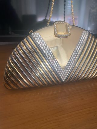 Bolso de fiesta dorado con pedrería
