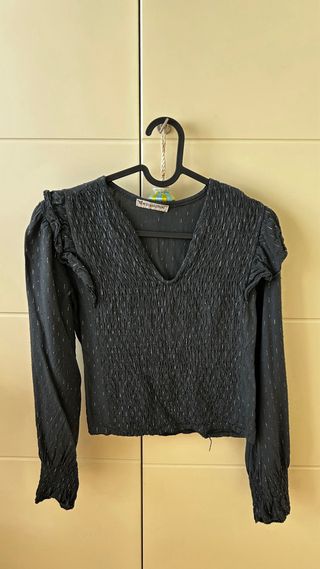 Blusa negra con brillos