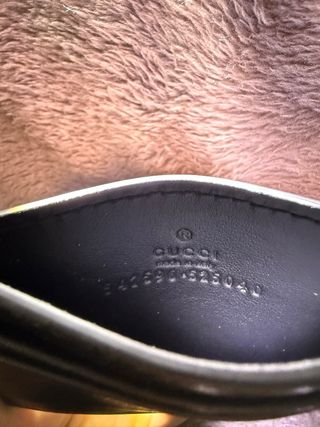 Portacarte Gucci nero con logo dorato