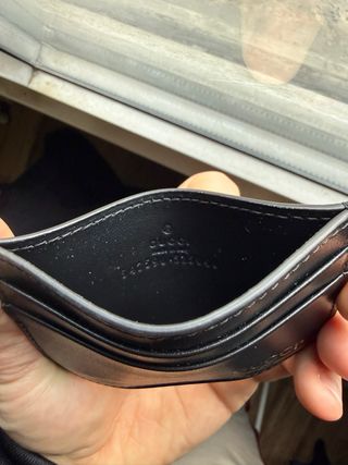 Portacarte Gucci nero con logo dorato