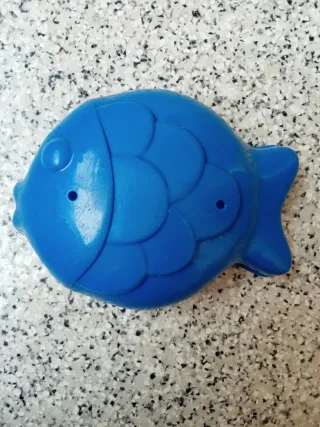 Forma de areia azul em peixe