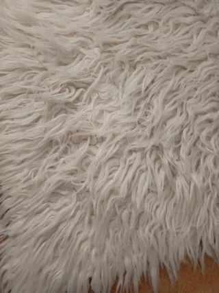 Alfombra de lana blanca