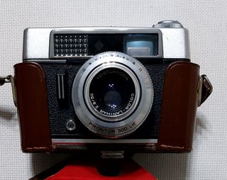 2 cámaras con funda más objetivo Tamron adicional