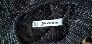 Blusa brillante cuello alto