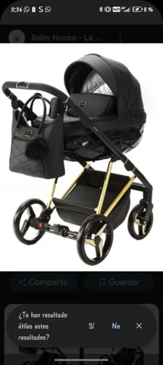 Cochecito de bebé negro y dorado