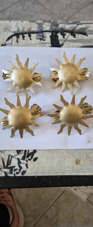 Ganci fermatende a forma di sole