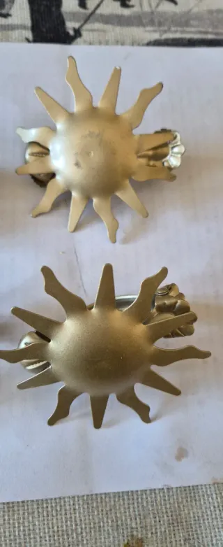 Ganci fermatende a forma di sole