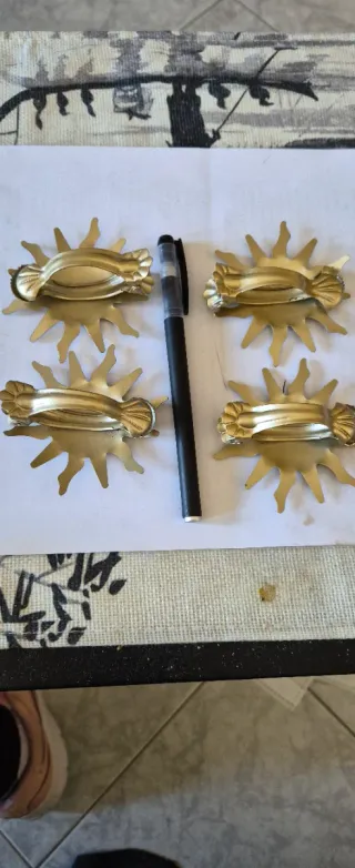 Ganci fermatende a forma di sole