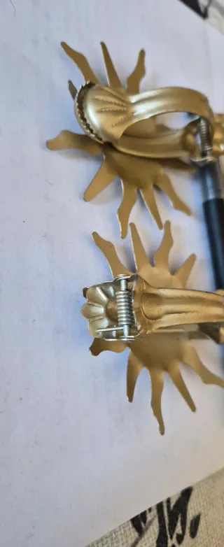 Ganci fermatende a forma di sole