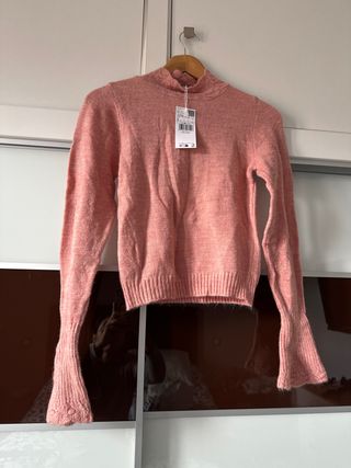 Jersey rosa cuello alto manga acampanada