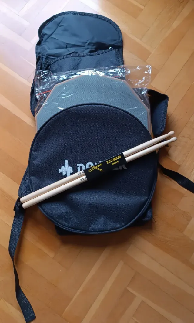 Pad de batería + funda + baquetas