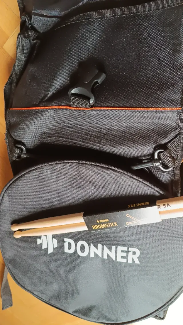 Pad de batería + funda + baquetas