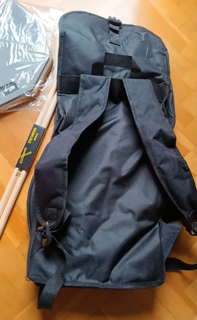 Pad de batería + funda + baquetas