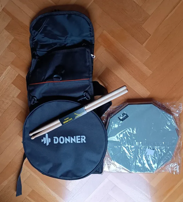 Pad de batería + funda + baquetas