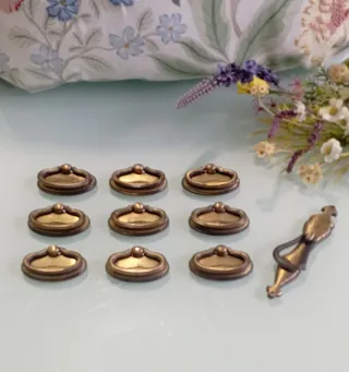 12 tiradores de cajón dorados