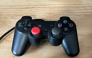 PS2 Slim Negra + T memoria + mando y cables.