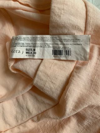 Pantaloni pesca chiari con bordatura nera