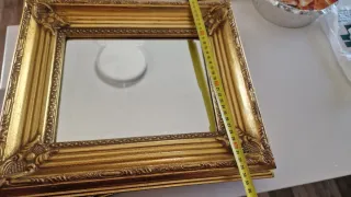 Specchi dorati con cornice intagliata