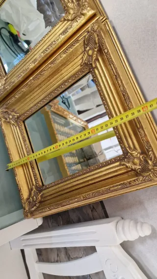 Specchi dorati con cornice intagliata
