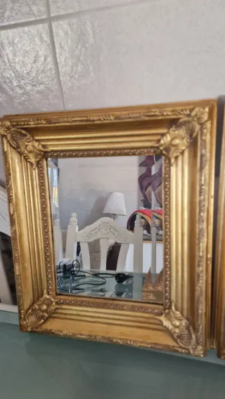 Specchi dorati con cornice intagliata